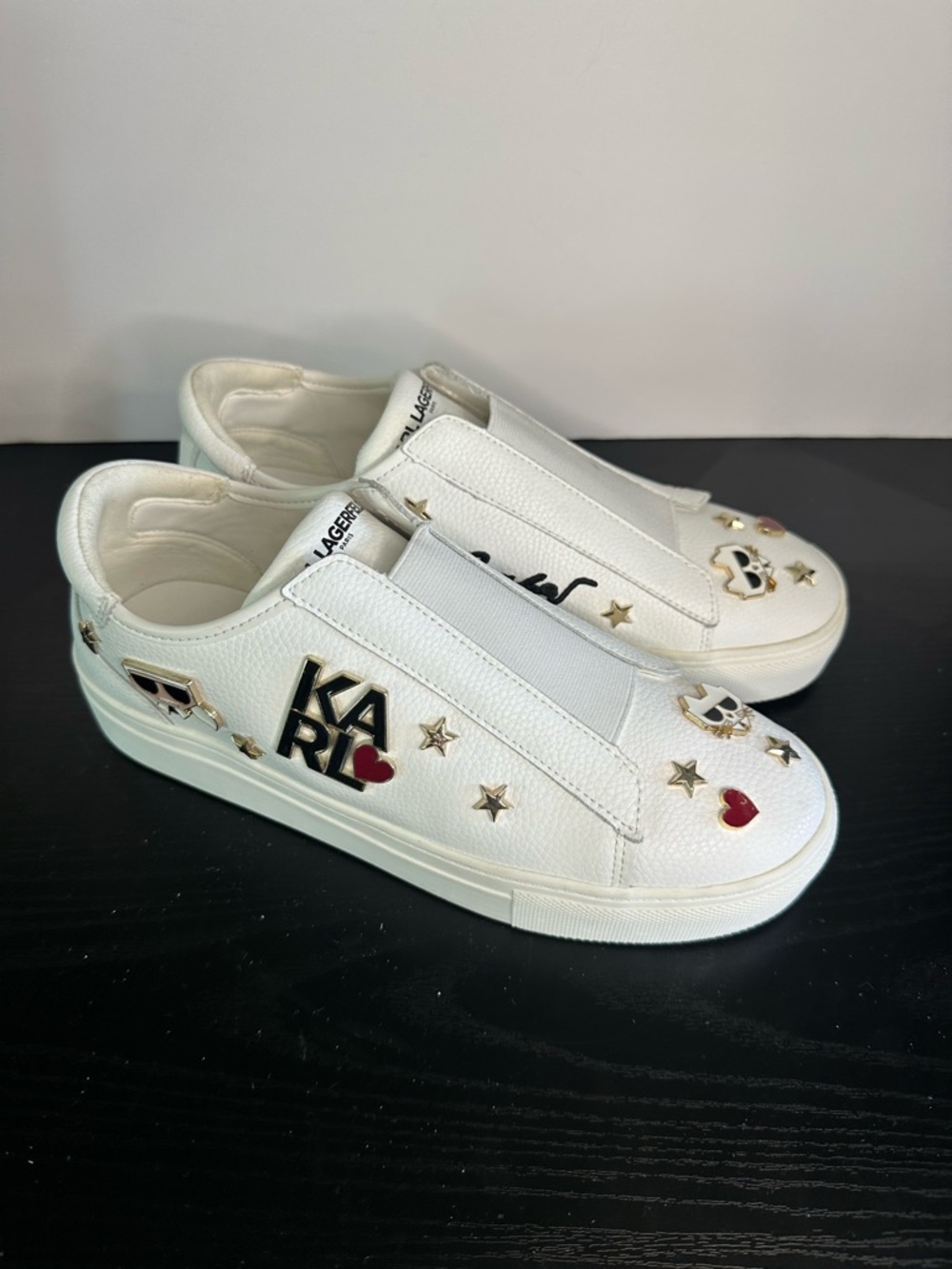 Karl Lagerfeld Caitie White Slip-On Sneakers with Gold & Red Icon Accents